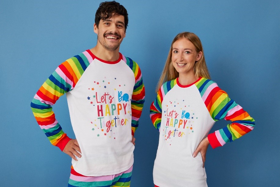 Man and woman wearing Alder Hey pyjamas