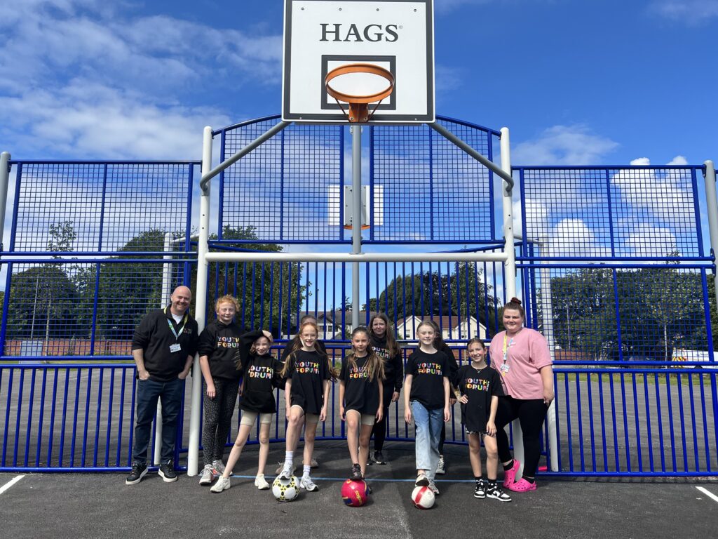 Alder Hey Youth Forum members play on the multi use games area on Springfield Park