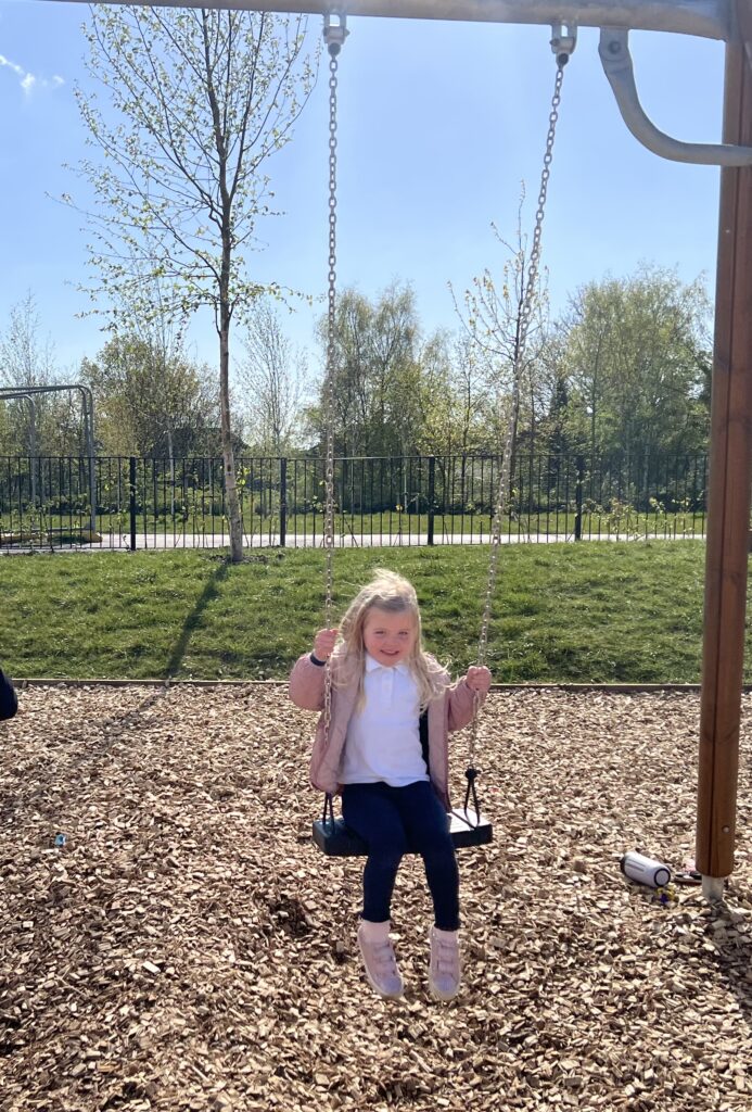 Clemence on the swings in Springfield Park