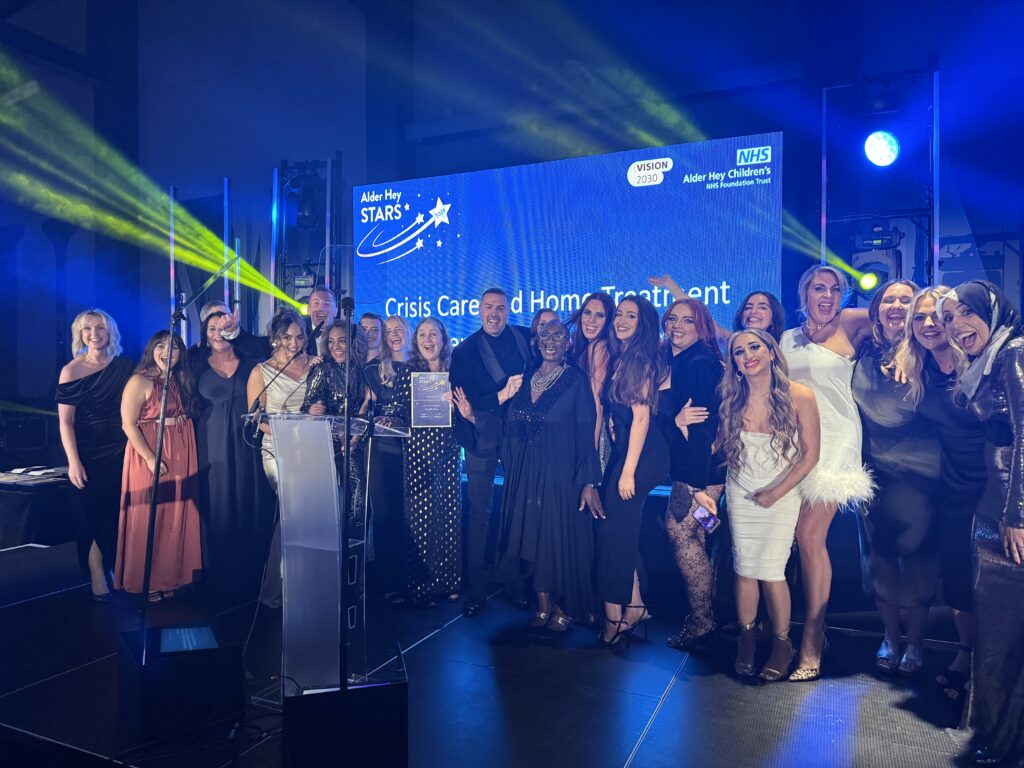 Living the Alder Hey values winners the Crisis Care and Home Treatment Intensive Support Team pictured with Paddy McGuiness