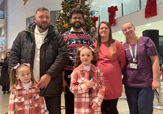 Dr Senthil and Alder Hey nurse pose for picture with patient Rubi-Mae and family