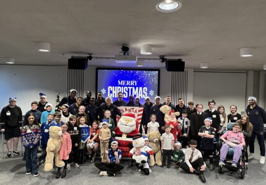 Everton first team squad and children at Alder Hey