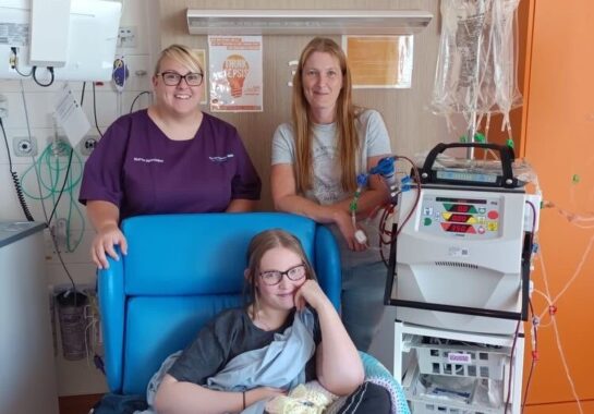 Mollie with nurse Leah and mum