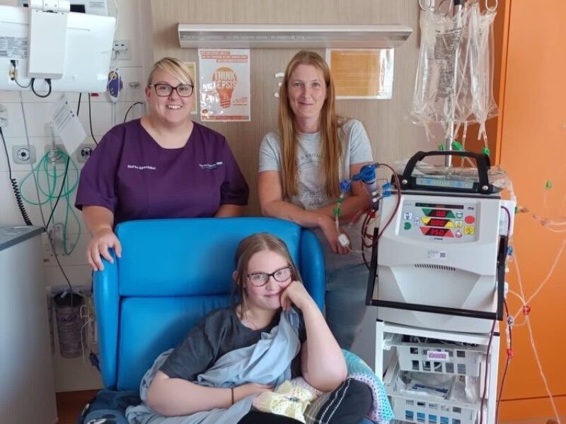 Mollie with nurse Leah and mum