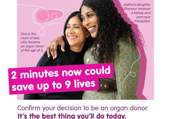 Two women encouraging people to register their decision for Organ Donation Week