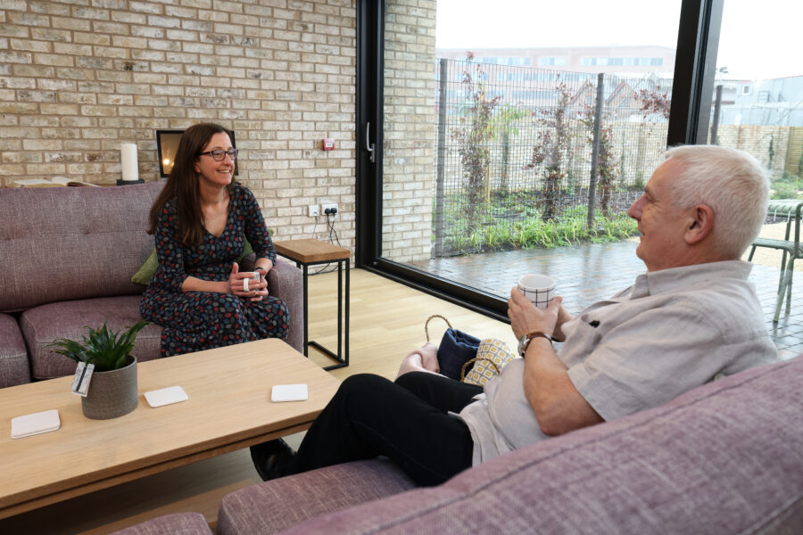 Two people talking in the Alder Centre