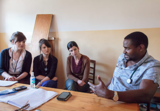 Doctors talking around a table