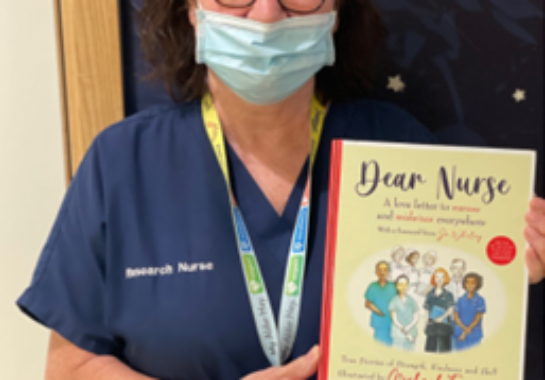 Jacqui Tahari holding Dear Nurse book