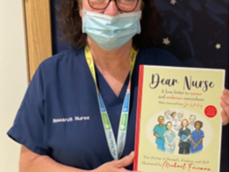 Jacqui Tahari holding Dear Nurse book